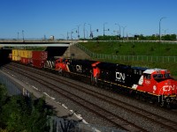 One of CN's newest units (ET44AC CN 3290) is leading CN 401, with ancient GP9 CN 4139 (originally built as CN 4287 in 1959) in third position.