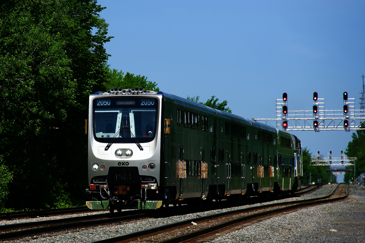After doing a test run from Saint-Jérôme to downtown Montreal and testing two tracks at Lucien L'Allier Station, EXO E172 with three new bilevel cars built by CRRC is heading back to Sortin Yard to tie down for the day.