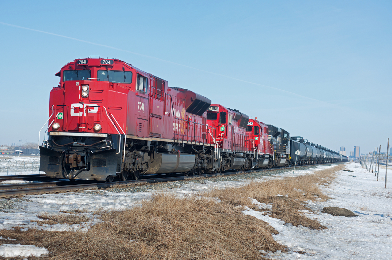 CP 7041,5018,4409,and NS 1033 make for an interesting consist on this day's train 411. After the usual bunch of work at Regina, Belle Plaine is the next stop and eventually on to Moose Jaw.