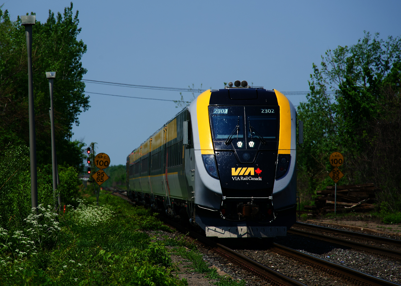 Passing speed limit signs that have been passed by numerous decades worth of VIA trains, VIA 24 with a Siemens consist heads towards its next stop at Dorval Station.
