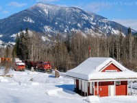 Wintertime in the mountains can be gorgeous, but it is a fickle enchantress. My fear of being stuck on the highway by an avalanche or accident kept me grounded close to home. Needless to say I didn't get out much during my stint in the mountains, but being home with code blue skies and an early afternoon westbound departing Revelstoke I headed to the Last Spike to see what I could work with. Pillowy snow coated everything at the historical landmark 45 km west of Revelstoke which is run by the Revelstoke Museum. The angles are tight here, and I tried my best to frame the Vancouver bound hotshot amongst the old CP van, monument and gift shop while also trying to get over the chain-link fence and deal with those pesky hydro wires. For those keeping track CP 9665 went through the rebuild program and came out as AC4400CWM CP 8109.