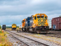The Hearst yard engine (ONT 2200) has cleared after building 516's outgoing train, seen to the left. Having cut off their inbound train from Cochrane<a href="http://www.railpictures.ca/?attachment_id=49837">(pictured here)</a>, the set of SD40-2's prepare to nose onto their train while the yard helper hitches a ride to normal the crossover switches. After switching engines and cutting in the brake line, 516 will be on the move "south" out of town, bound for Cochrane. The Hearst engine will couple up and begin to disassemble the inbound 313 consist before continuing the tasks of servicing the local industries.