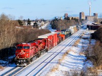 Accelerating out of Thunder Bay, the era's "Switcher" rolls over Neebing Ave westbound with work at locations like Dryden, Vermilion Bay, Trus Joist and Kenora. <br><br>

A number of things here have changed in the years since this shot. <br><br>

First off, the SD90Mac trailing disappeared the year after this photo was taken- only to languish for about decade before being rebuilt into an SD70ACu. The "farm leads" loaded with boxcars for the local paper mill were taken our of service and the tracks removed in the coming years, while the smoke stack from the local OPG plant puffing away here, came down sometime in 2021. Progress.....