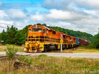 The westbound Huron Central freight is seen approaching McKerrow with HCRY GP40-3 3802, HCRY RM-1 802, QGRY GP38 2008 and HCRY GP40-2LW 3013 hauling 131 cars. The "above average" length of this freight was due to G&W shuttering operations in the weeks prior as they were looking for a handout from the government in the range of $30 million to upgrade and upkeep the tracks. With terms agreed to, Huron Central gathered up many of the cars dwelling in Sudbury and set off down the Webbwood Sub. After a couple of switching moves at McKerrow the crew will head south down the last remnants of the Little Current Sub to service the pulp and paper mill in Espanola.