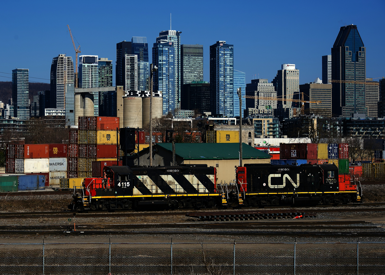 CN 4115 & CN 7020 are returning light power from dropping off grain cars at a nearby client.