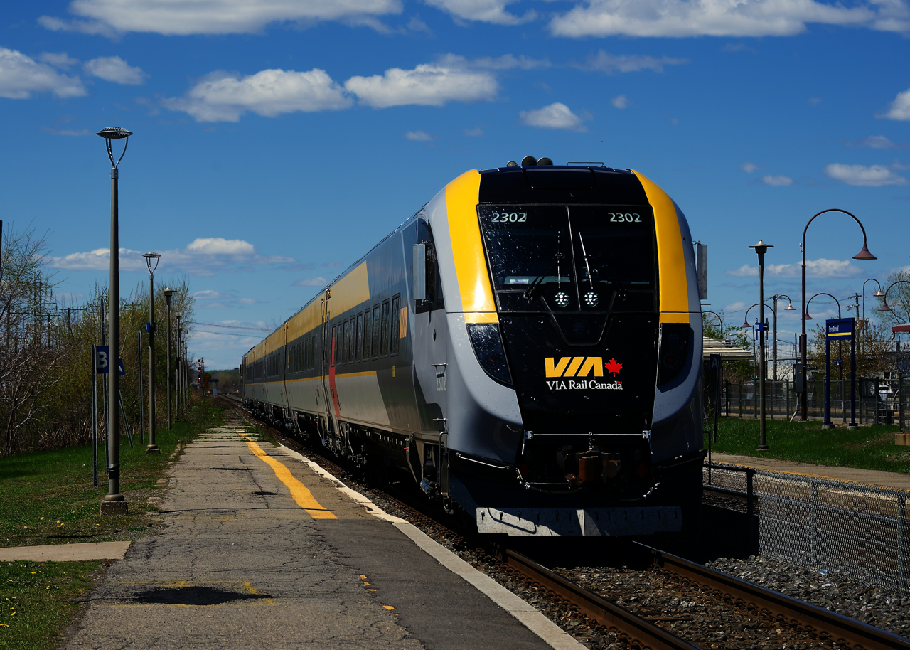 VIA 24 is arriving at Dorval Station with a Siemens consist as the cab car leads.