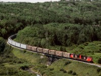 Eastbound train 452 on CN's Prairie North Line has just crossed from Saskatchewan to Manitoba and crosses Boggy Creek, a tributary of The Assiniboine River