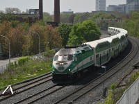 An eastbound GO service, that could use its face washed, passes MP 331 on the Kingston Sub, May 12th, 2023.  The south track has been out of service for some time as part of the Lakeshore East line expansion.  This will be the location for the planned Gerrard station and interchange with the Ontario Line.
