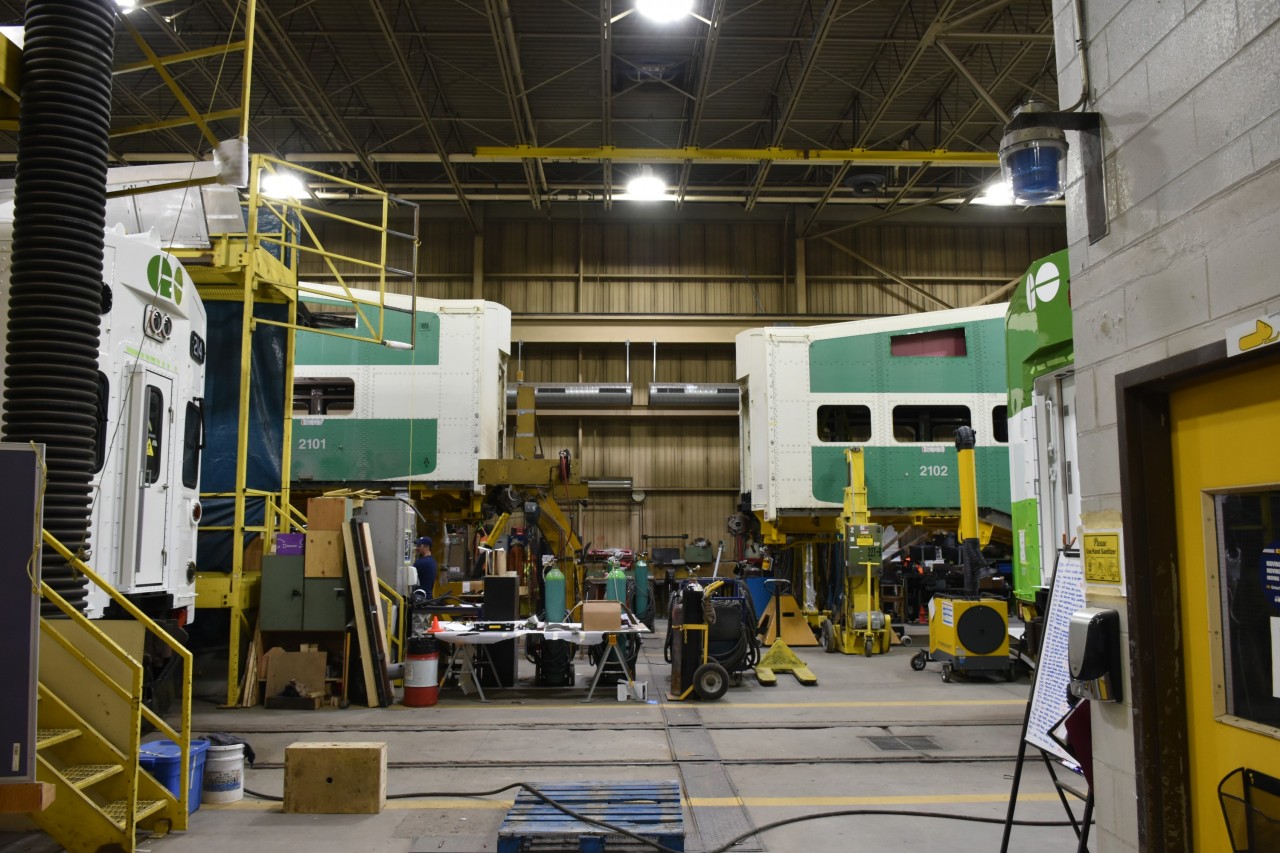 Can I get a lift? 
Sister cars GOT 2101 & GOT 2102 got the lift and support necessary for undercarriage work to be completed during overhaul at the ONR shops in North Bay, ON. The car shop building was full to the brim with a number of GO Transit coaches and cab cars going through the rebuild program on this nice spring April 13, 2023 morning. 
The car shop, diesel shop, and yard were all full of nice surprises as I walked around the facilities on my guided tour this day. More photos to come. :-)