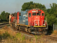 CN L542 with GTW 5849 and CN 4770 have just started their day and are seen approaching Alma Street in Guelph, Ontario with cars for the North Industrial Spur. 