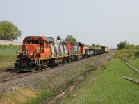 L551 with CN 4717 and CN 9639 has a short train today, four gons and two lumber loads as it heads east toward Tansley for a meet with a west bound. 