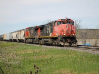 CN 2515 sporting a weathered cab, white class lights and wearing the CN North America Map scheme leads with CN 2656 trailing heading down the north track of the Halton Sub. at Mile 46.1.