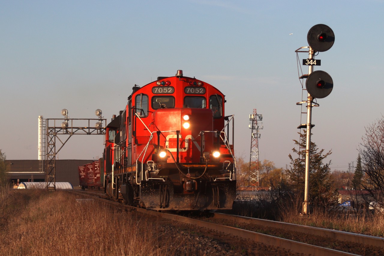 CN 551 has just completed running around their train after switching out Crawford Metals and Taiga Lumber in Milton and is seen here through CN Milbase headed back to Aldershot for the evening, with 7052 taking the lead.