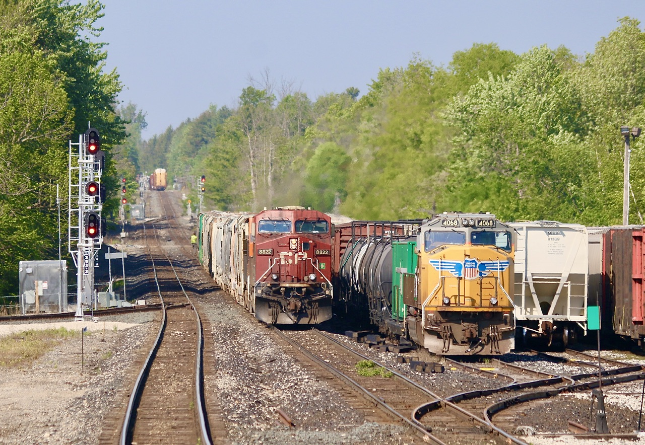 CP 134 ended up being delayed a bit thanks to a seized brakes in a freight car. Her the bad car and a set of cars has just been dropped in the yard as 134 with a ES44 and BNSF AC44C4M 613, a former Santa Fe Dash9 back to their train, while CP’s weed spraying train with a UP SD70 awaits a fresh crew. The UP SD70 had kept railfans busy over the weekend as it replaced a CP SD40-2 suffering mechanical issues.