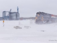 Let it snow! March break means a family road trip, which means finding trains in unfamiliar territory. I've had my eye on the Sartigan Alcos ever since OSR sold them and I jumped on my opportunity to chase. Here, M420W pair 2044 and 2047 pull 2 cars out of the Aliments Breton grain elevator, just outside Scott QC. The snow falling & wind blowing across the Quebec countryside help spice up the image (and help usher me back to the warm of my car). 