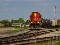 A warm May day last year brought me out to Stratford, ON, where after following 568 from Kitchener with RLK 4095 in tow (set off just before this frame), they are now seen putting together their outbound train for customers further down the line towards Pottersburg. They are pictured here running up the ladder track, framed beside Jordan spreader CN 50948, which has spent the last year and a half resting away in the MOW tracks after the ill-fated work extra last year. Full consist that day into Stratford was CN 4131- CN 9427- CN 7521 - RLK 4095 and a measly single tank car. 