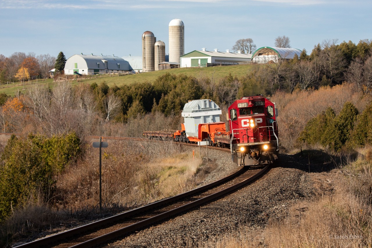 CP 3113 leads DIM-045 East on the Belleville Subdivision with a Hydro One dimensional load.