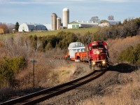 CP 3113 leads DIM-045 East on the Belleville Subdivision with a Hydro One dimensional load.