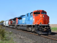 CN 384 accelerates out of Brantford after crossing over at Masseys with the GTW heritage locomotive leading.  Photographed at Bethel Church Road, between Brantford and Lynden.