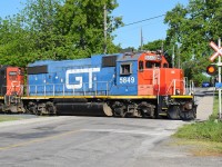 GTW 5849 leads the 07:00 job "down the hole", crossing Simcoe Street East on the N&NW Spur on their way to spend the morning switching north end Hamilton industries.  In true Hamilton fashion, I spent a good length of time kicking garbage out of the shot, only to have a homeless dude show up and park his shopping cart right in the way.  Thankfully, he allowed me to relocate his worldly possessions so I could get the photo and not interrupt his scavenging. 