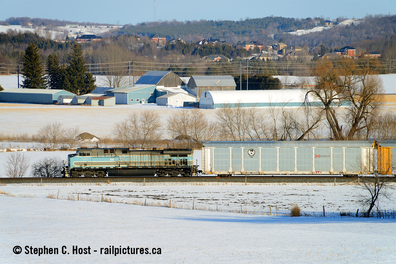 Just north of Alliston and south of the Baxter siding on the Mactier sub is this really nice spot with rolling farmlands. It almost looks like the scene is made for the CMQ paint scheme with the farms blue and greys matching the CEFX 1002 just perfectly. CEFX 1002 was on lease to the CMQ and when CP purchased the railway leases went with it. This lease was or is set to expire in June 2023 unless it gets extended. 1002 was a CP leased unit prior to CMQ and CMQ took lease in 2018.
