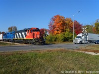 With a nice clean repainted 4713, CN L542 passing some rainbow like fall foliage in Guelph as they are about to cross what locals call the "Hanlon Expressway" in Guelph. An expressway with at grade railway crossings. Sure. The fall colours in 2022 were quite good.