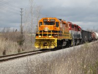 With only a few cars trailing today QGRY 2301 and RLK 4095 are heading west at Mile 2.1 on the Stelco Spur about to cross Haldimand Road 3 preparing to stop at the gate to Stelco - Lake Erie Works. 