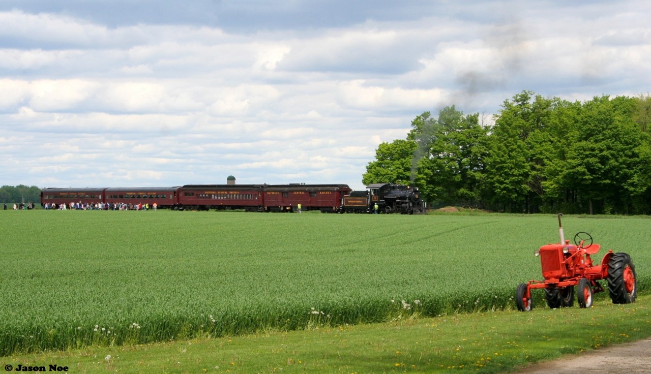 Waterloo Central Railway 0-6-0 # 9 is viewed during a photo run-by reloading passengers on the Victoria Day Monday in 2022 just north of St. Jacobs, Ontario on the Waterloo Spur near the Highway #85 crossing. This was the first time #9 had operated in a long time following a two-year retrofit and its 10-year boiler inspection as well as other modifications.