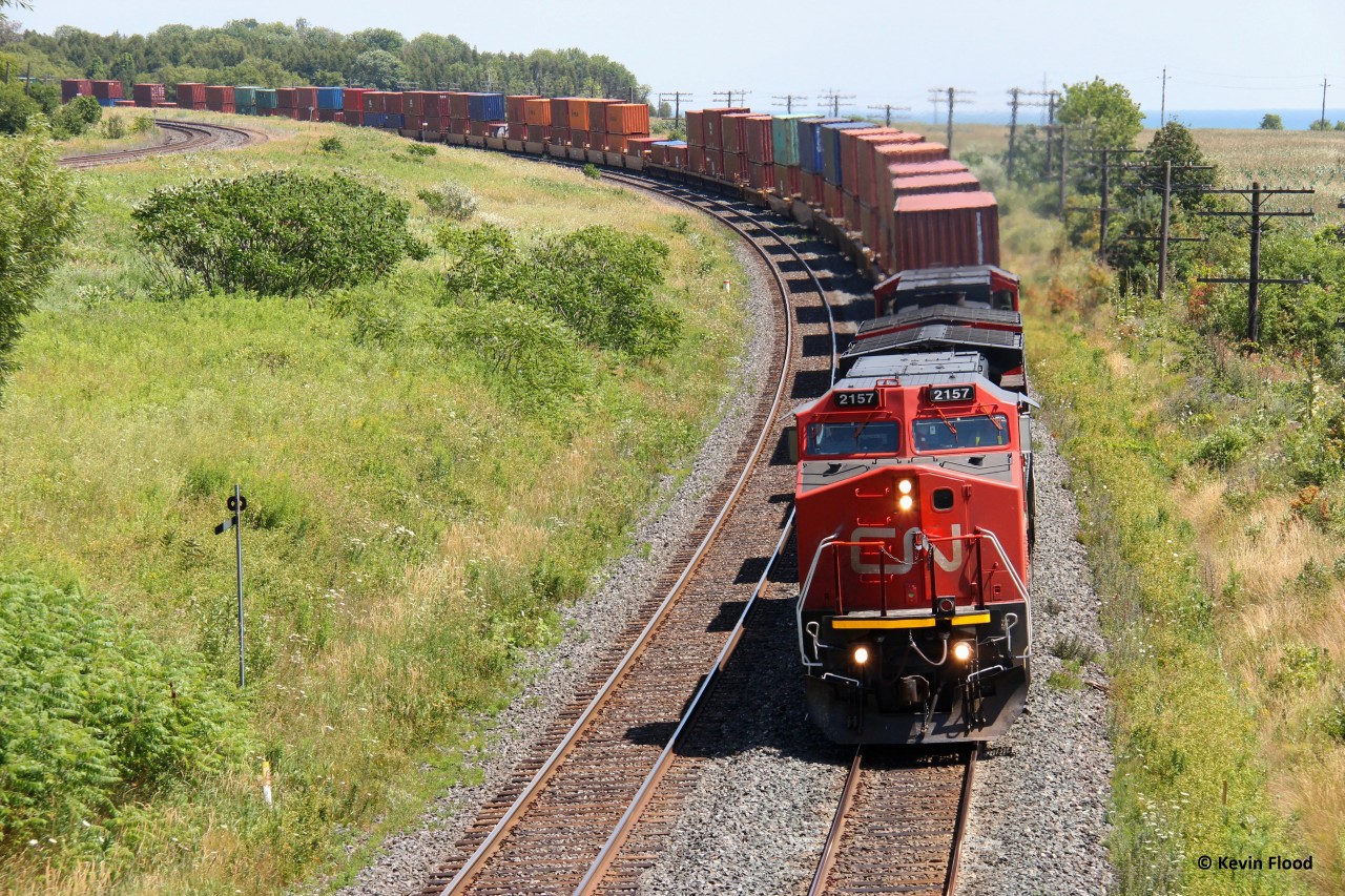 Back in the summer of 2012, I stopped at Newtonville east of Toronto where the CN and CP mainlines parallel each other to try and get some action. Caught this westbound stack train with CN 2157 leading.