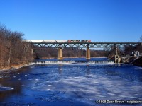 CN Eastbound with CN 5359 East crossing the Grand River on a Cold winter morning in Paris, ON.
