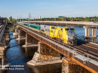 la voie qu'on aime. VIA Rail Canada 909 (P42DC/EPA-42a) led train 669 (Montreal, QC-Toronto, ON) on the afternoon of May 29, 2023, seen crossing the Sainte-Anne-de-Bellevue Canal approaching Bellevue Island, Montreal, Quebec. The 5 car-LRC train is lead by a P42 that is one that VIA wrapped in this advertising scheme, with English (love the way) on one side and French (la voie qu'on aime) on the other. 