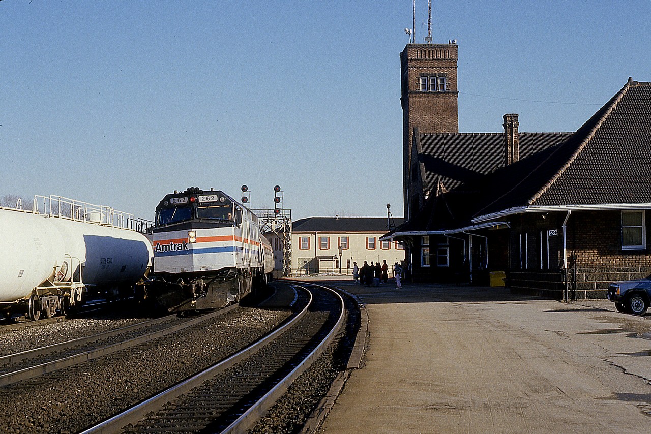 Amtrak number 81, the International Limited, is seen westward at Brantford station on a cold but sunny January morning.
The gathering by the station are waiting for VIA #71, due about 15 minutes later at 1008 hrs.