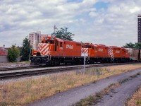 Three of CP's recently rebuilt GP units, two being former Toronto, Hamilton & Buffalo units, approach Hunter Street station.  All three units would survive until the end of the GP7/9 era on CP in the mid 2010s.  CP GP7u 1684, <a href=http://www.railpictures.ca/?attachment_id=40161>former TH&B 74,</a> emerged from rebuild just one year earlier, would be retired in 2013.  Second up, CP GP 7u 1686, the <a href=http://www.railpictures.ca/?attachment_id=40019>former TH&B 76,</a> would be retired in 2012.  Finally CP8205, originally, CP 8648, would be retired in 2014.