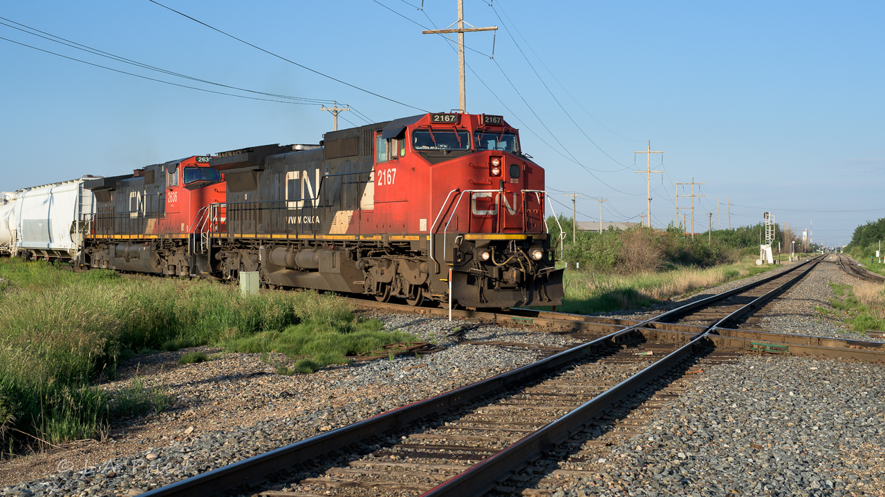 Another gull wing cab to go with Kevin Flood's recent CN 2157. The 2167 is about to cross the CP at the East Edmonton diamond. It was early in the morning and the trip from Mirror almost over, the crew hopefully in bed before the sun gets to high.