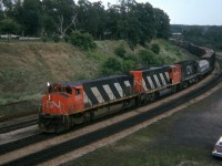 One of my early efforts, summer 1974 showing CN 2524, 9458 and 3224 heading westbound thru the junction and up onto the Dundas sub. Variety was what it was all about back then, before the onslaught of the hundreds of  GP40-2L ( example: #9458) locomotives that came on the scene in the latter half of 1974 thru 1975.