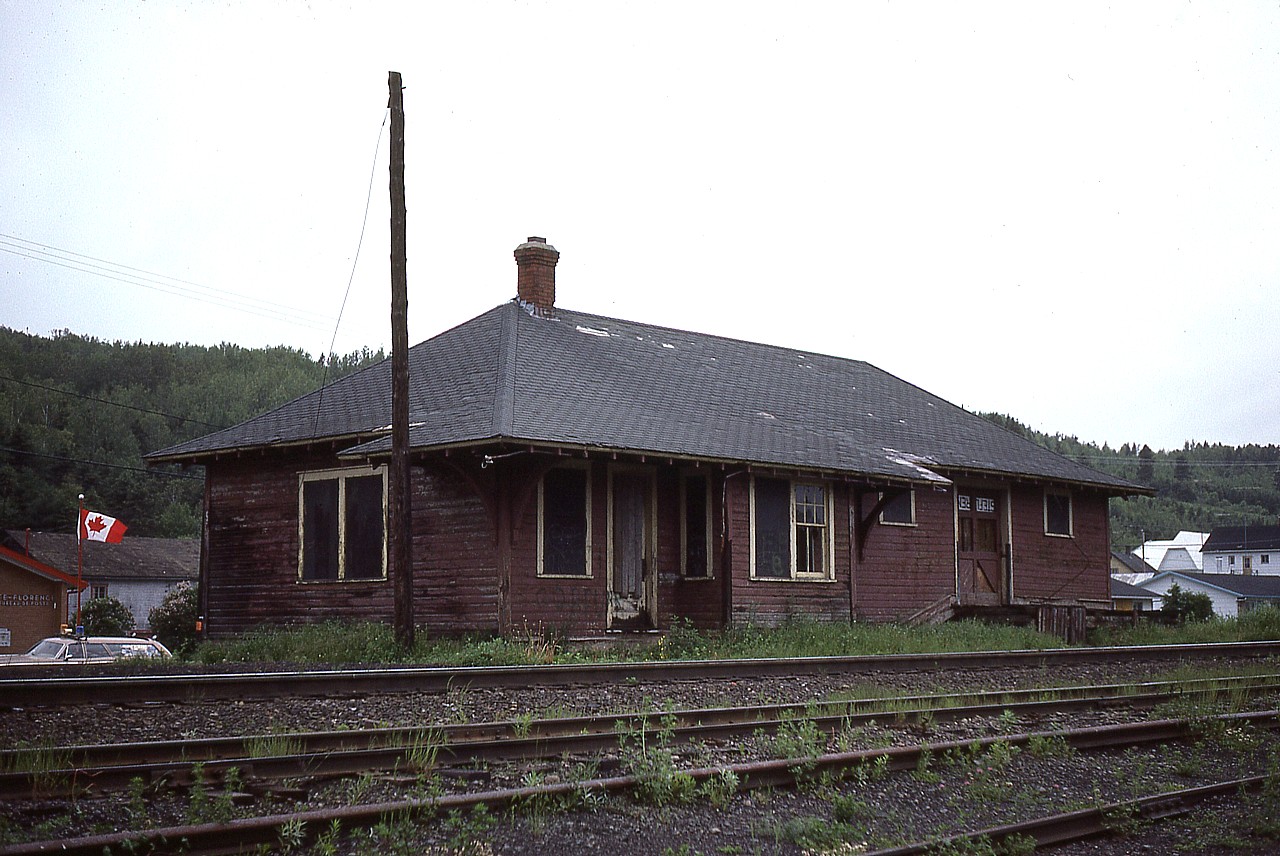 The station at Sainte-Florence, Quebec. Looks like it doesn't have very long to live. It is situated along the old Intercolonial line up from New Brunswick to the St. Lawrence area town of Mont Joli, hence the subdivision name.
I would love to get some information on this place. Photos I have seen do not resemble this image, yet I went thru my notes and lined up slides and they were numbered in accordance as I shot Routhierville before and Causapscal after as I traveled along the line so what else could it be? Hopefully someone will know so I can rest my curiosity.