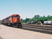 During a spring afternoon, CN 384 with 5377, GT 5822, GT 5859, 9624, 5763, 2425, 2547, 6015 and 5022 is passing the Brantford, Ontario station on the Dundas Subdivision. Also, HLCX 113 and RaiLink 1751 were the Southern Ontario RaiLink power in the yard in Brantford on this day.