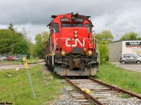 On an otherwise overcast spring afternoon, former CN hump yard GP38-2’s 7502 and 7512 are viewed during a lucky sunny break assigned to CN L542 in Cambridge on the Fergus Spur. In fall 2022, this assignment’s origin was changed from Cambridge to Kitchener. 