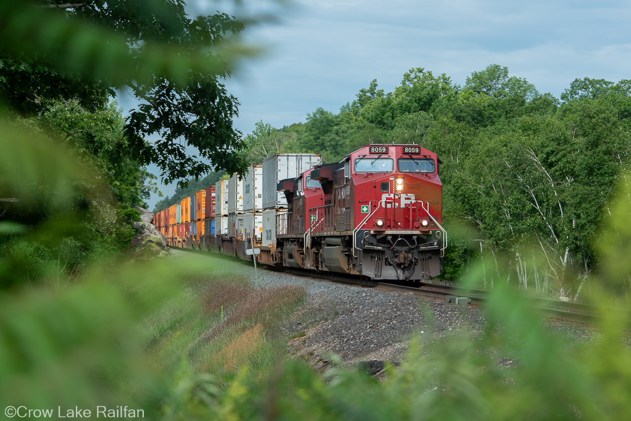 A CP 132 & 230 combo breaks the silence at Crow Lake this morning. The train has intermodal from Chicago and mixed freight from Bensenville Illinois. This is the first train since the early morning 113.