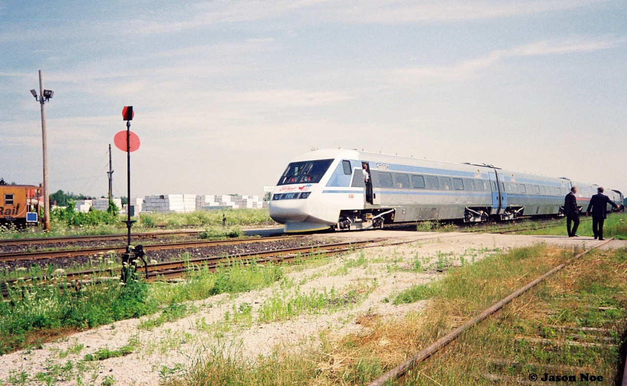 In summer 1993, my first trip to CP Guelph Jct. ironically wasn’t to photograph a CP train, but rather a promotional passenger train set. So the story goes, in July of that year CP sponsored the tour of the X2000, which was a Swedish State Railways train set built by Asea Brown Boveri (ABB) on their lines in Quebec and Ontario. The week-long promotional tour of the two provinces then followed several months of testing and display of the train in the United States by Amtrak. The Toronto portion of the tour was followed by two X2000 excursions to Guelph Junction and return via the Galt Subdivision. 

I forget exactly how we found out about it, which was likely through word of mouth at the time, but my dad, myself and a friend arrived at Guelph Jct. ahead of the train’s arrival and immediately realized we weren’t the only ones there. Many other railfan’s, the media and everyone else in between were there to take in the event as well as the crew of the CP local to Guelph, which was powered by an RS18u. For a 13-year-old kid just learning how the mainline’s in Southern Ontario worked, there was so much to absorb let along a futuristic passenger train. I snapped many photos on my small Kodak camera of the train that day and in the end only a few really turned out not too bad. 

Here the X2000 is seen arriving at Guelph Jct. amidst a large fanfare with Amtrak F40-2 380 powering the train on the opposite end. The caboose to the left is the tail-end of the one car CP local to Guelph.