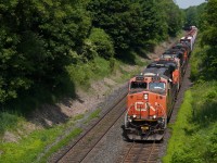 CN 2233 leads M397 as it climbs up the hill before meeting U714 at Copetown West.