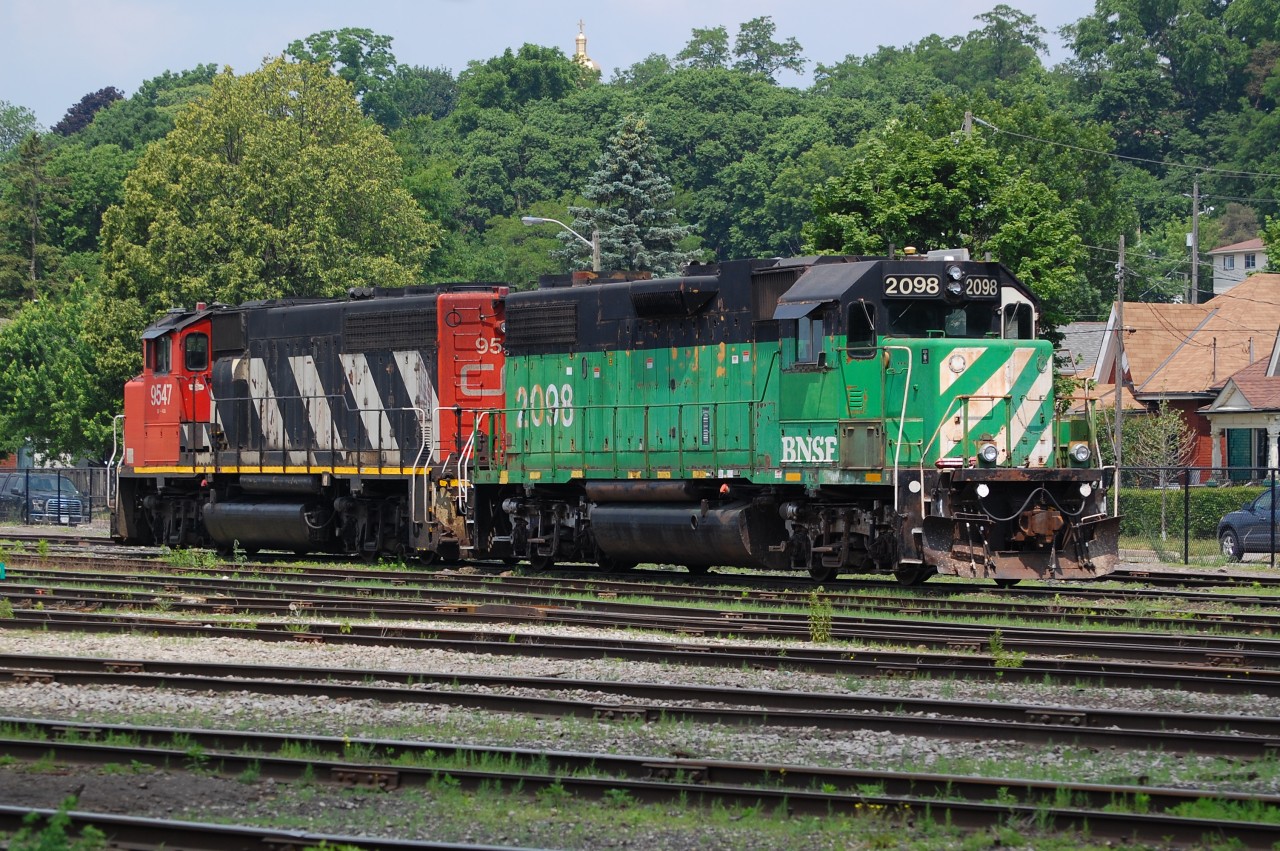 On a nice sunny morning at Branford BNSF GP38-2 2098 and CN GP40-2(W) 9547 shut down between assignments as 580/581.