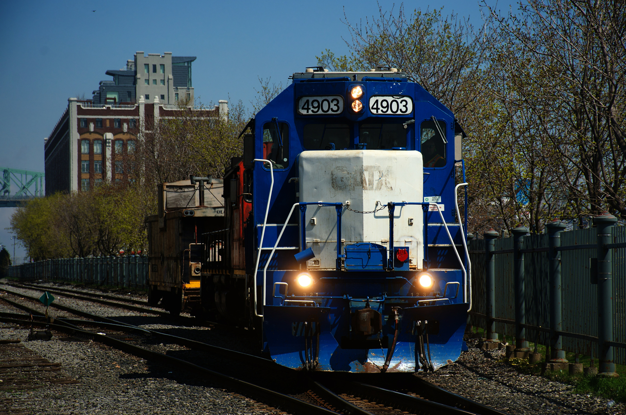 CN 500's power backs up to grab its caboose before picking up its cars in the Port of Montreal.