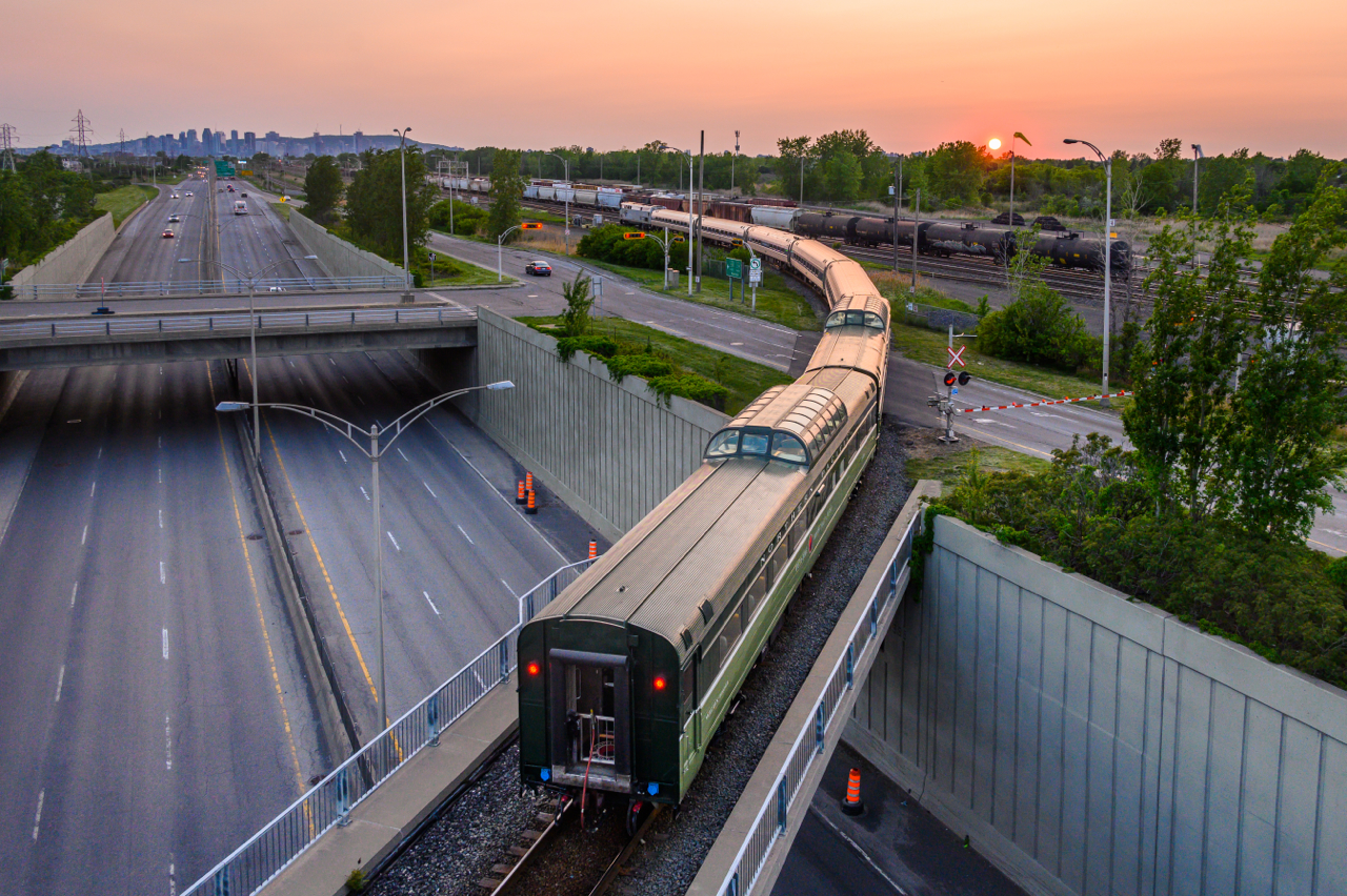 A pair of ex-Northern Paciifc dome cars (now owned and run by Webb Rail LLC) are on the rear of the northbound Adirondack just after passing CN Cannon, as AMTK 695 approaches its final stop at St-Lambert Station. Cars are WEBX 801044 (ex-NP 313) & WEBX 801045 (ex-NP 549). Both were built by Budd, in 1954 and 1959 respectively.