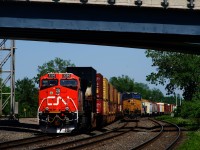 Fresh ET44AC CN 3290 brings up the rear of CN 106 (parked on track DX1) as CN 327 approaches Dorval Station with CSXT 7202 leading.