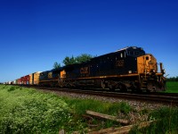 CN 327 with rebuild CSXT 7202 and CSXT 802 passes a private crossing near Coteau, where they will leave the Kingston Sub for the Valleyfield Sub. As they leave the Kingston Sub, they will be told by Car Control that they have to set off a bad order car at Coteau.