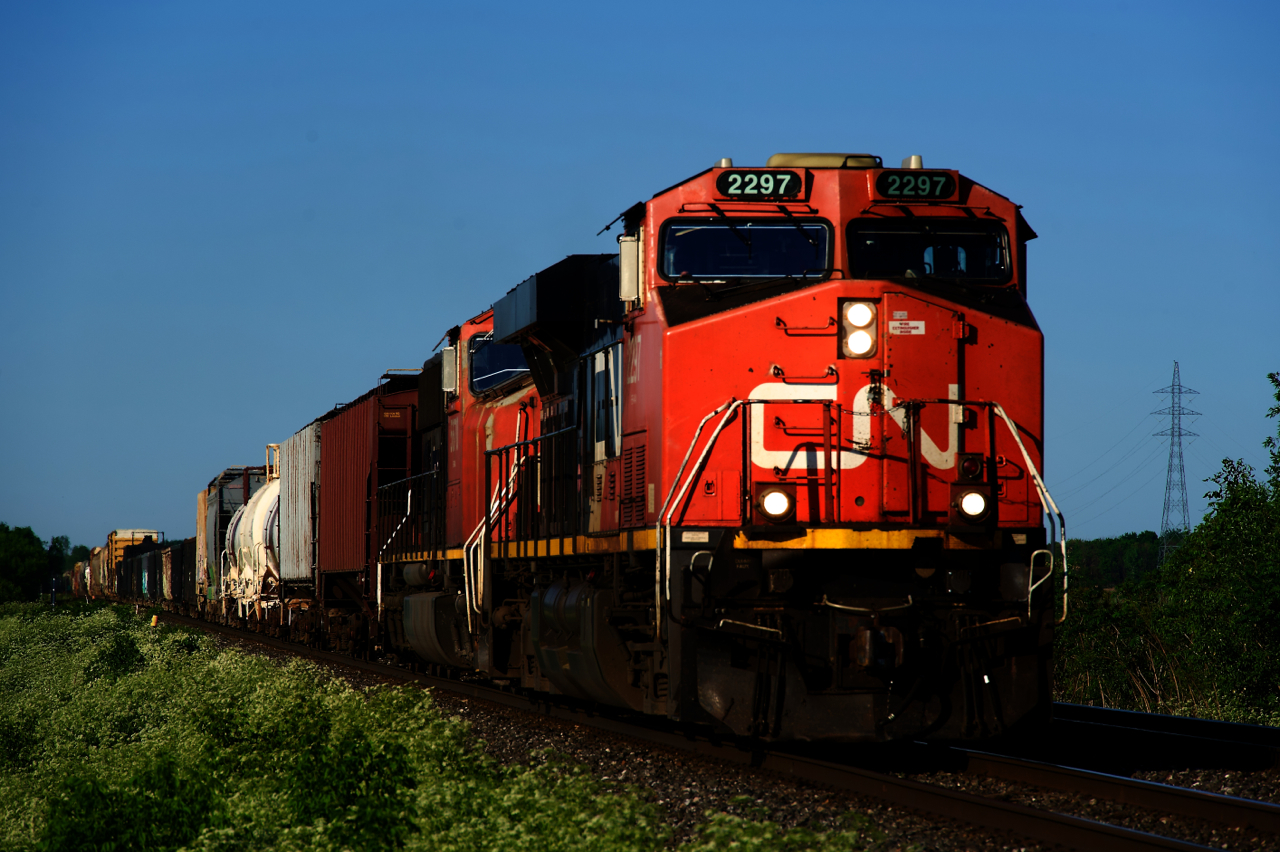 CN 321 is heading west with a pair of DC units on a lovely spring evening.