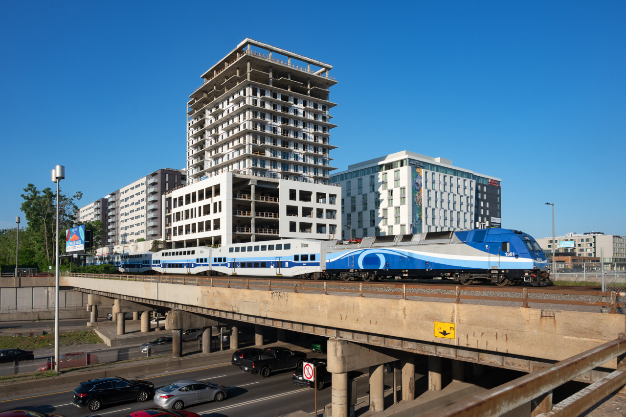 EXO 192 crosses the congested Décarie Expressway on the longest day of the year.