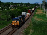 CN 327 has some stacks up front as it heads west with CSXT 5391 & CSXT 4534 for power.