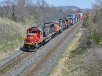 <br>
<br>
A General Motors  trio working the Northumberland Hills. 
<br>
<br>
CN 5439 is the second unit to wear that number, an EMD 1986 built SD60 acquired 2012, the former GMTX 9092 (OWY 9092, EMD owned the loco's and leased to Oakway Leasing) along with 89 sisters from GMTX / EMTX: GATX Rail Locomotive Group, LLC
<br>
<br>
[ the first 5439 was GMD 1987 built SD50F, CN owned 60 built 1985 – 1987, all retired 2007 – 2008 ] 
<br>
<br>
Second unit is CN 5673 a GMD 1999 built SD75I, and the third is CN 8909 an EMCC 2010 built SD70M-2.
<br>
<br>
Near CN Newtonville, May 8, 2014 digital by S.Danko
<br>
<br>

